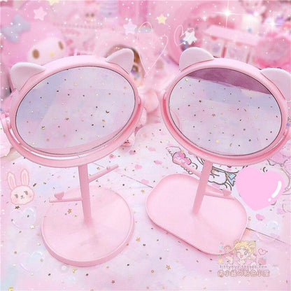Cat-ear dual vanity mirror with two round mirrors on pink stand base