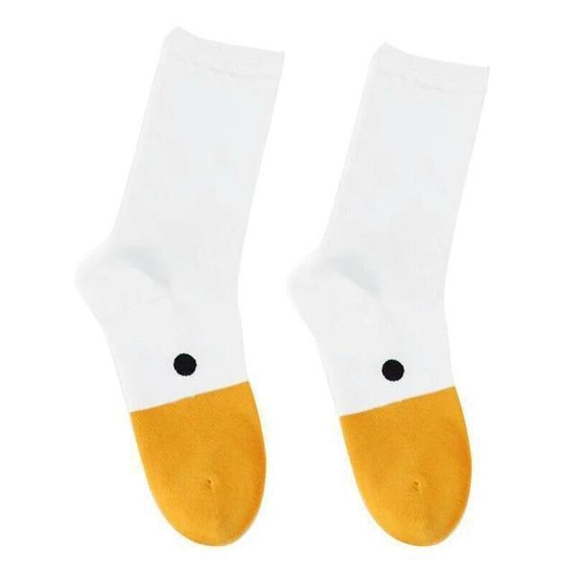 White crew socks with orange lower foot, black dot detail