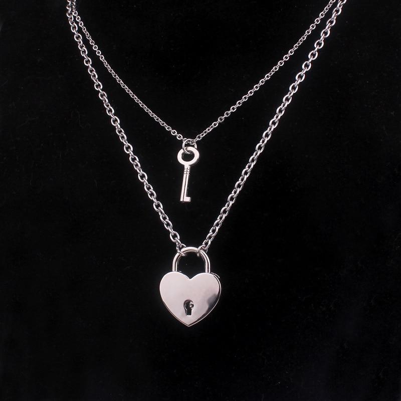 Heart lock and key necklace with silver-tone chains, key charm, and heart padlock