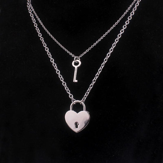 Heart lock and key necklace with silver-tone chains, key charm, and heart padlock