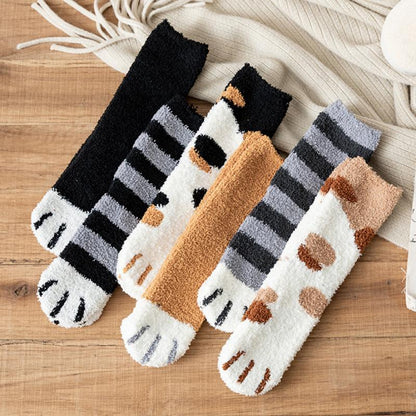 Set of knit socks with striped and cat face designs in black, tan, and gray