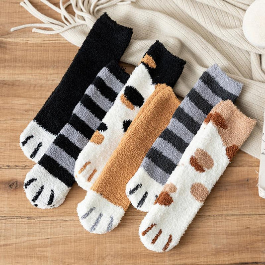 Set of knit socks with striped and cat face designs in black, tan, and gray