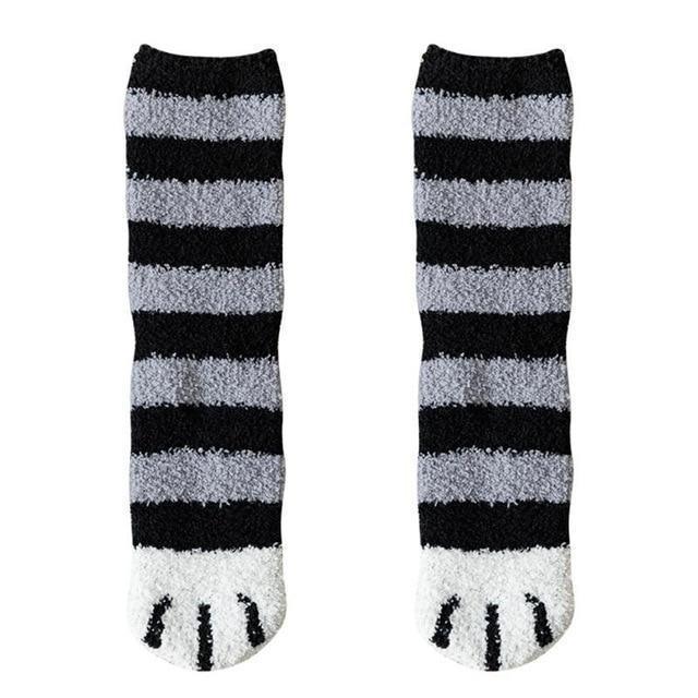 Black socks with light gray horizontal stripes and white toe panel cat-face detail