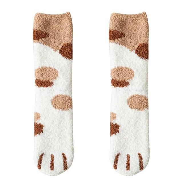 Cream knit socks with brown spots and white toe panel with black cat-face detail