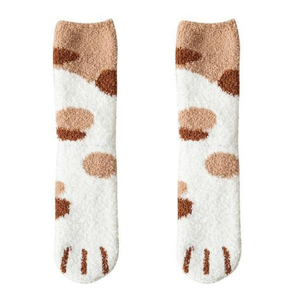 Cream knit socks with brown spots and white toe panel with black cat-face detail