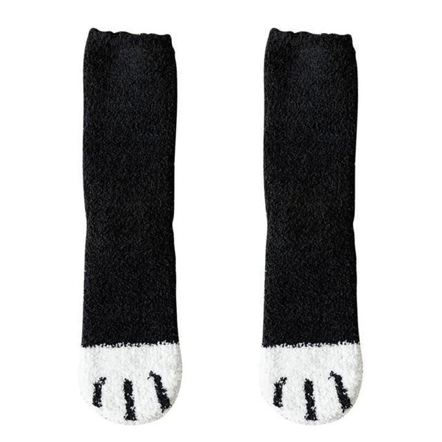 Black knit socks with white toe panel and small black cat-face design