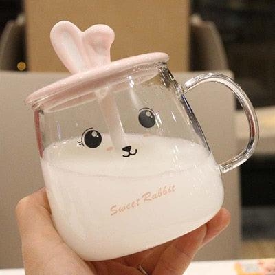 Glass bunny mug with handle, bunny-ear lid, and face graphic on white interior