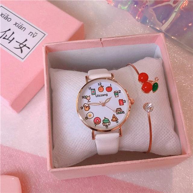 Gift box set showing white strap watch with food-themed dial and cherry charm bracelet