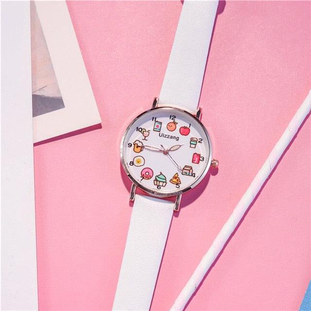 White strap wristwatch with round silver bezel and colorful food-themed dial