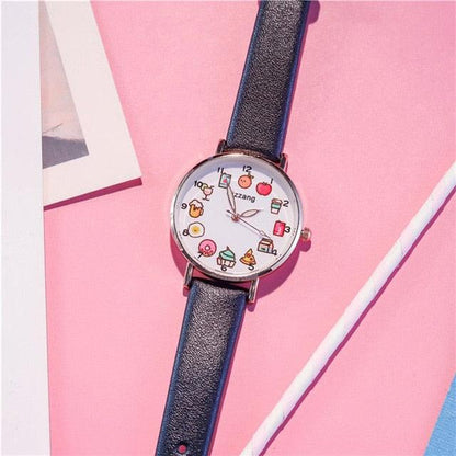 Blue strap wristwatch with round silver case and colorful food-themed dial