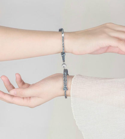 Magnetic attraction bracelet set, light blue braided cord bracelets with small round clasps