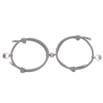 Magnetic attraction bracelet set, gray braided cords with silver tube ends and heart charm medallions