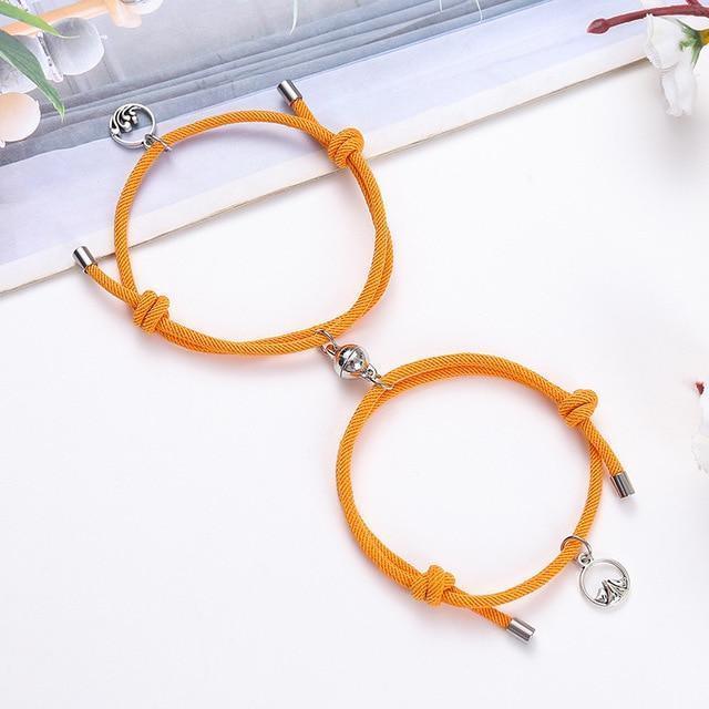 Magnetic attraction bracelet set, orange braided cord with silver tube ends and heart charms