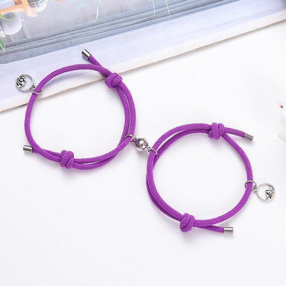 Magnetic attraction bracelet set, purple braided cords with silver heart charms and ends
