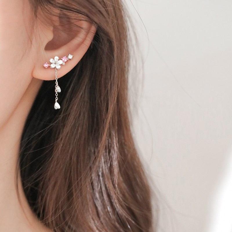 Cherry blossom drop earrings with pink crystal flowers and dangling teardrop charm