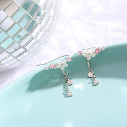 Cherry blossom drop earrings with pink crystal details and dangling heart charm strands