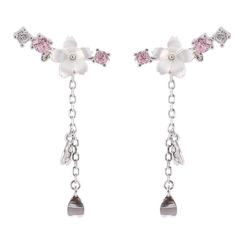 Cherry blossom drop charm earrings with pink crystal flowers and long teardrop dangles