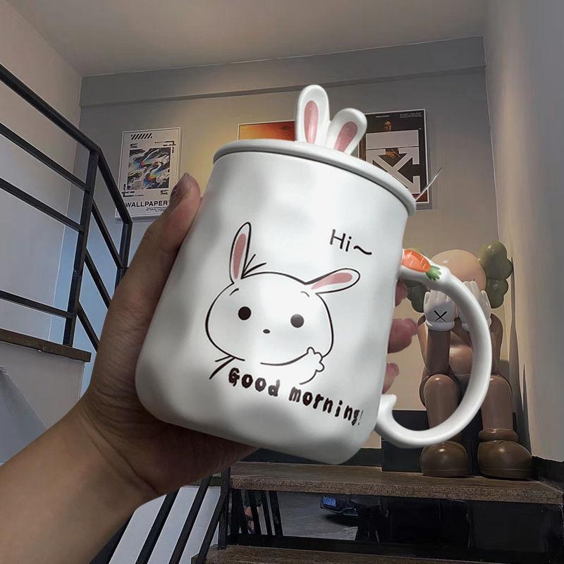 White ceramic bunny mug with rabbit face and 'Hi~' message on front