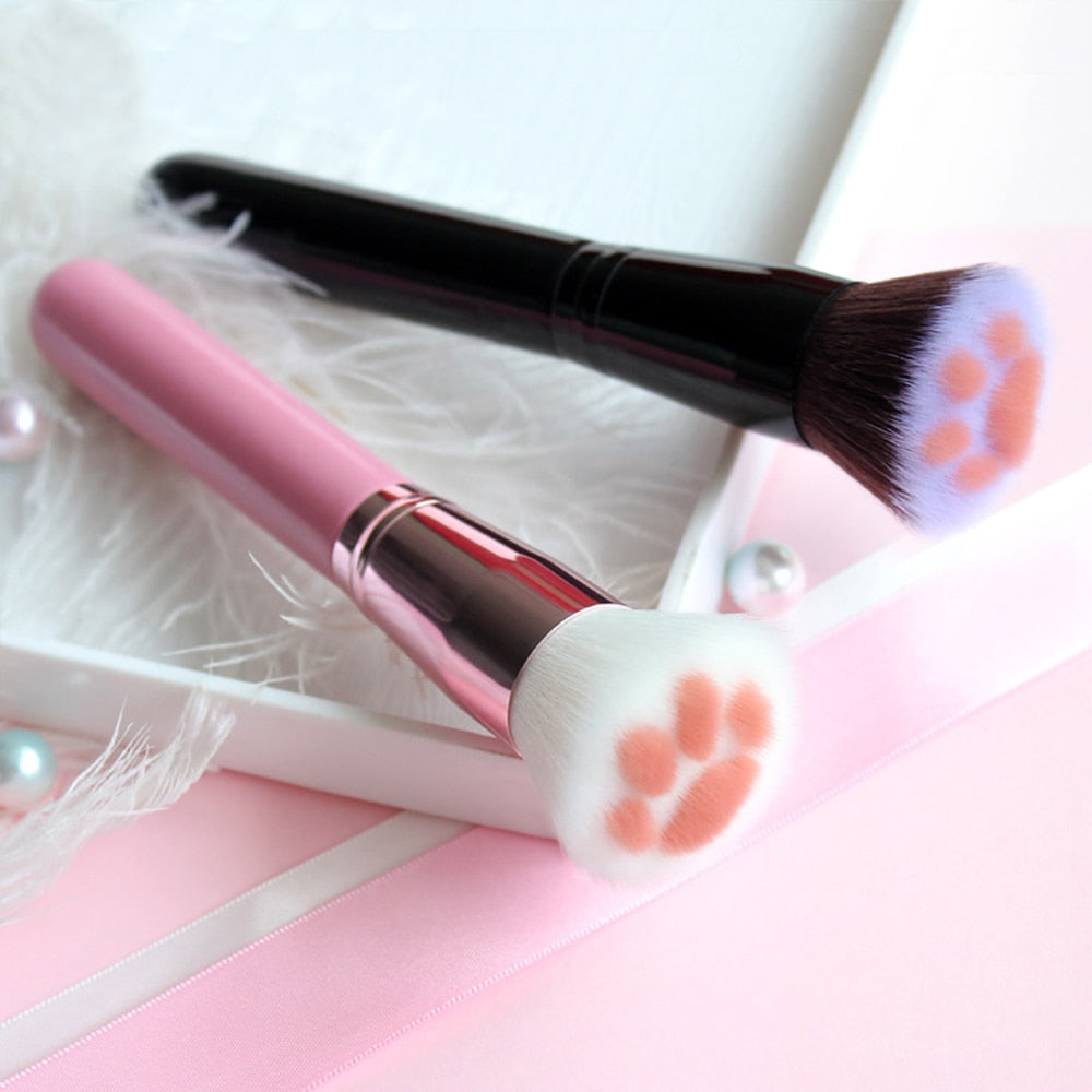 Cat paw makeup brushes with fluffy bristles and pink/black handles