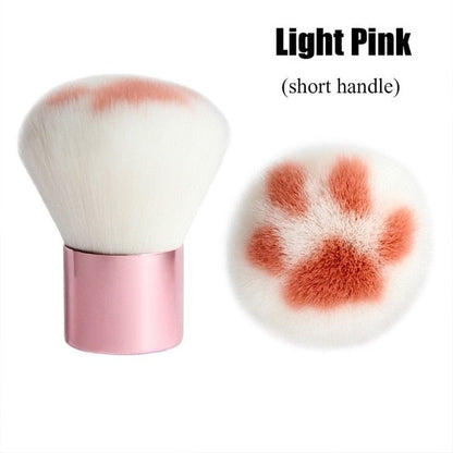 Light pink short-handle cat paw makeup brush with white bristles and orange paw pads