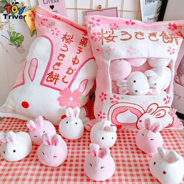 Bunny pillow plush set with white and pink bunny plush figures in a patterned bag