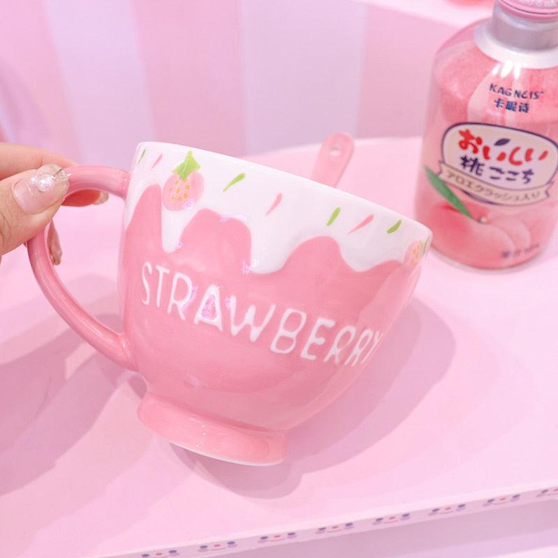 Strawberry milk mug with pink handle, drip graphic, and strawberry print