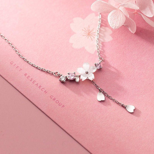 Silver-tone sakura pendant necklace with heart-shaped charms and flower cluster