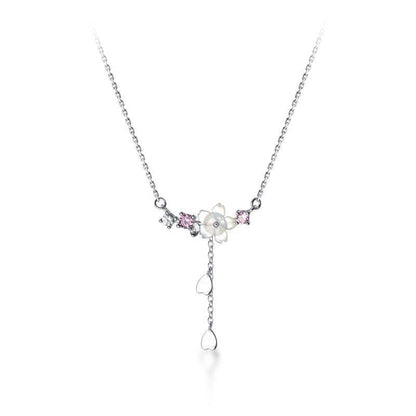 Silver-tone sakura pendant necklace with pink stones and hanging teardrop charm