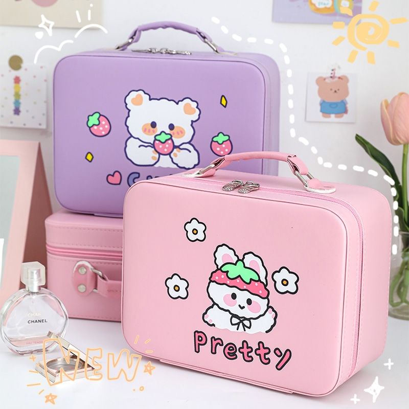 Lilac and pink kawaii animal makeup storage cases with lid mirror and flower character graphic.