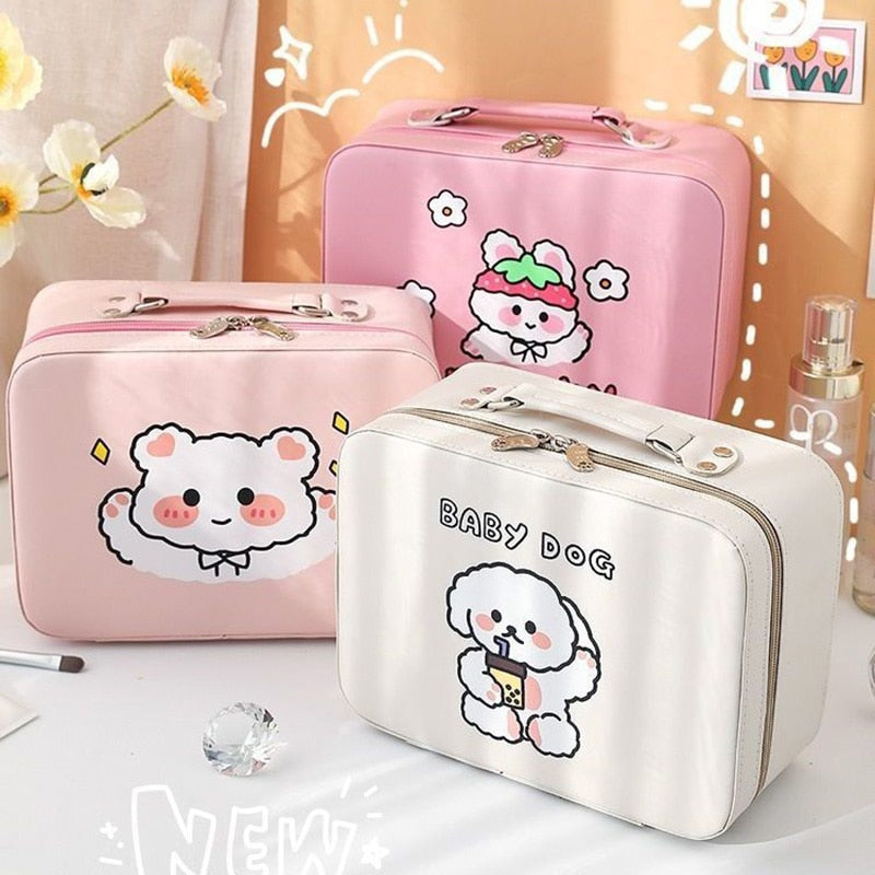 Set of pink and cream kawaii animal makeup storage cases with lid mirrors and cute prints.