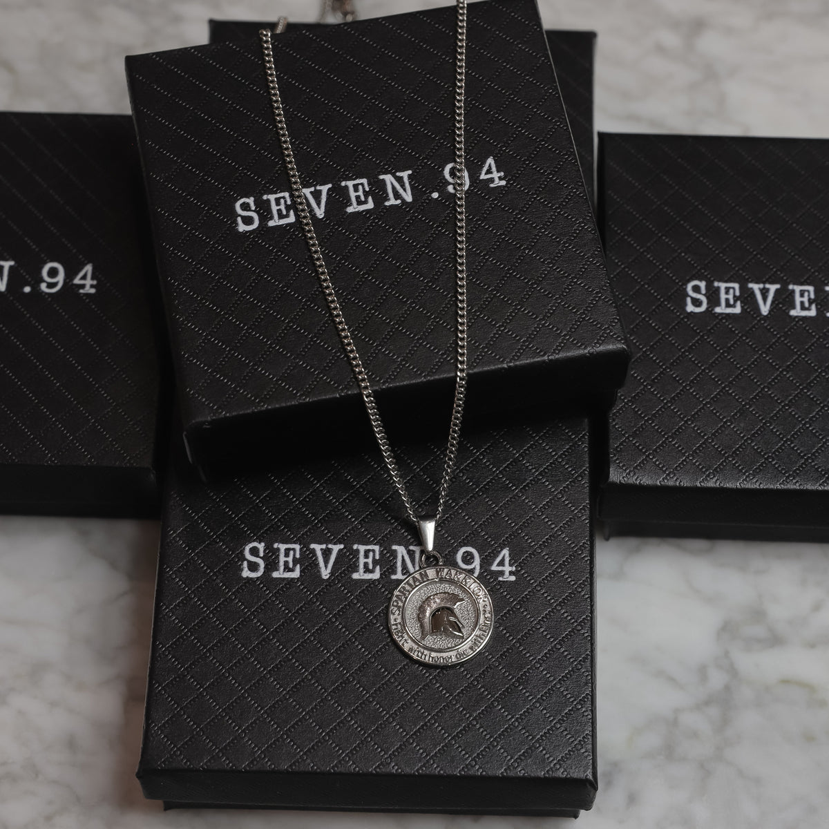 Spartan warrior pendant necklace with round emblem on black gift box