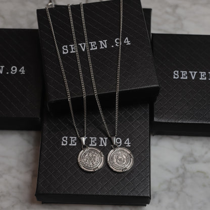 Pair of silver Saint Benedict medal necklaces with round medallion pendants
