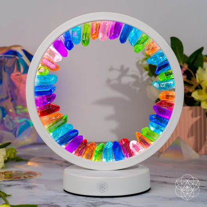 Circular multicolor aura lamp with glowing rainbow ring on a white base