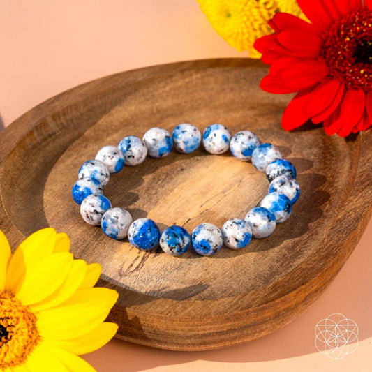 K2 stone bead bracelet with blue and white round beads on an elastic band