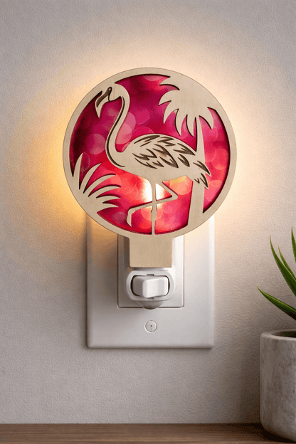 Flamingo tropical LED nightlight with circular tropical design and pink light glow, wall plug