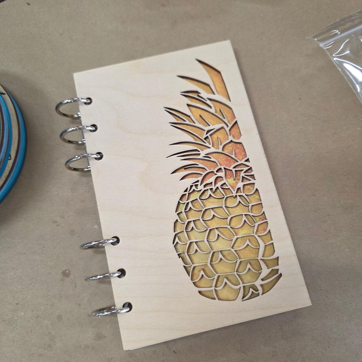 Refillable A6 wood journal notebook with pineapple engraving and metal ring binding, cover