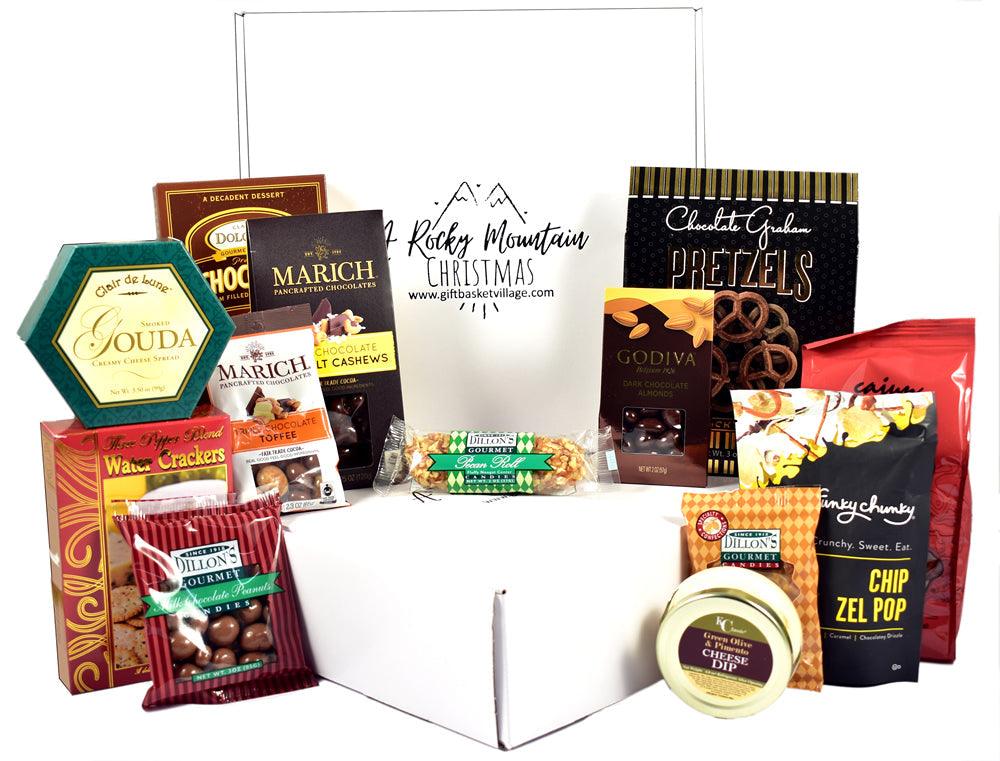 Assorted Christmas gift box with assorted chocolates and cookies, shown open in tray