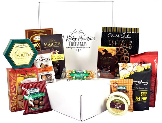 Assorted Christmas gift box with assorted chocolates and cookies, shown open in tray