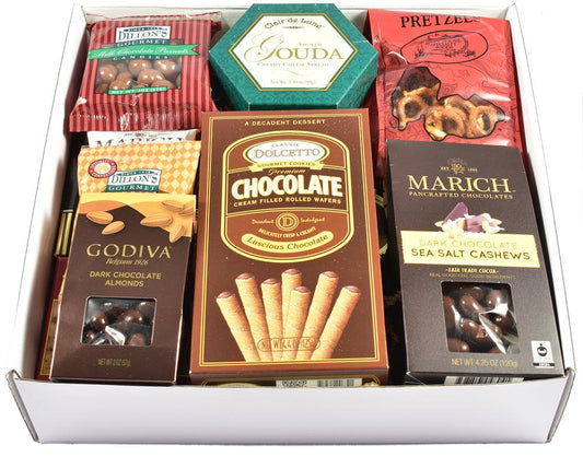 Open gift box filled with chocolate bars, pretzels, and cookies, arranged in rows