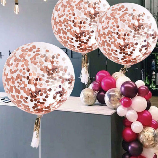 Cluster of giant rose gold confetti balloons with white-pink tassel tails