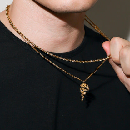 Gold serpent rose pendant necklace with twisted chain links and coiled rose charm