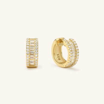 Gold-tone baguette hoop earrings with row of clear baguette stones
