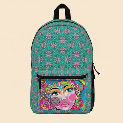 Teal patterned art backpack with black zipper pocket and colorful face front panel