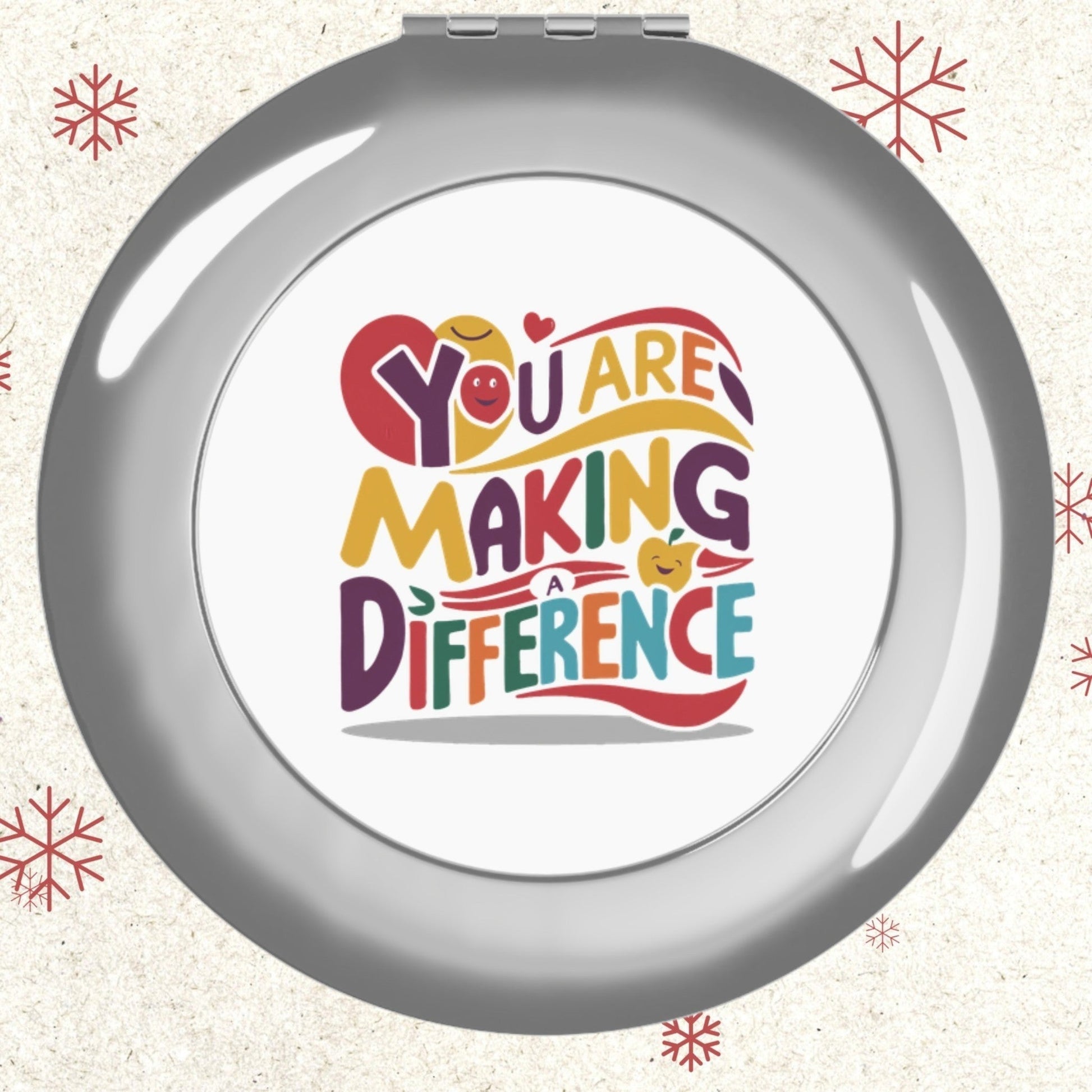 Silver glossy compact travel mirror with front face logo panel, round design