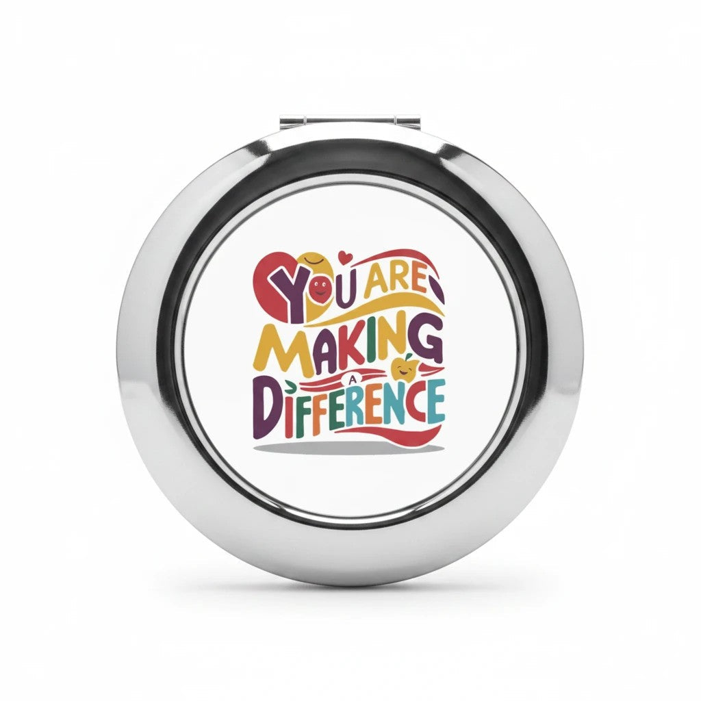Silver glossy compact travel mirror with centered logo graphic on front