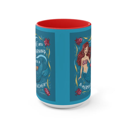 Blue illustrated accent mug with red interior and mermaid side artwork