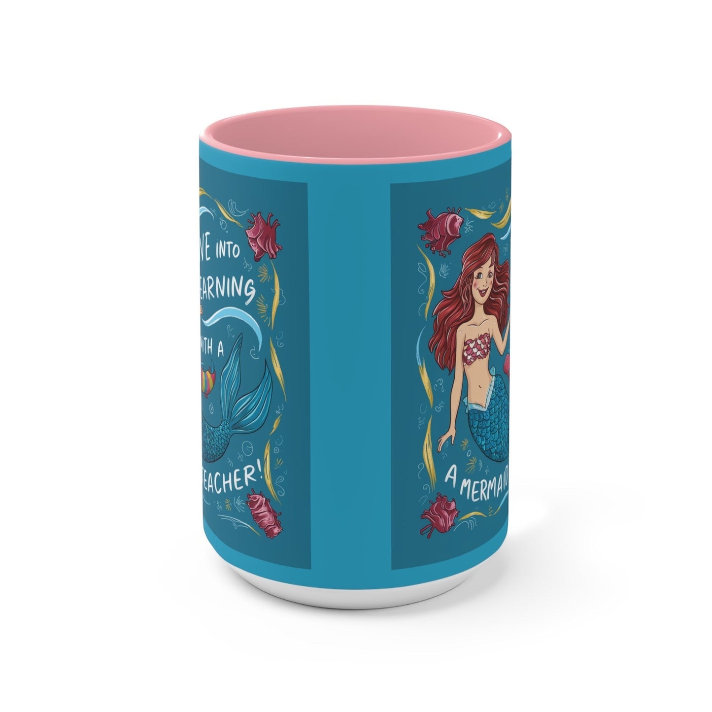 Blue illustrated accent mug with pink interior and mermaid scenes