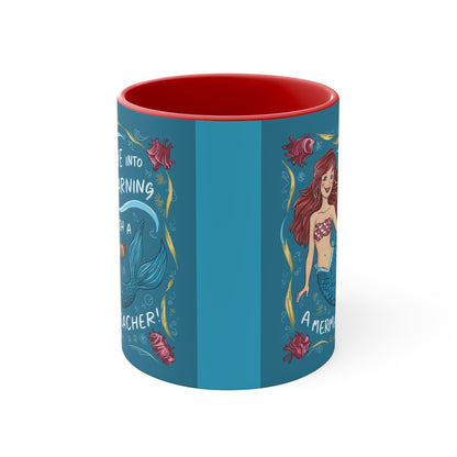 Blue illustrated accent mug with red interior and mermaid scenes