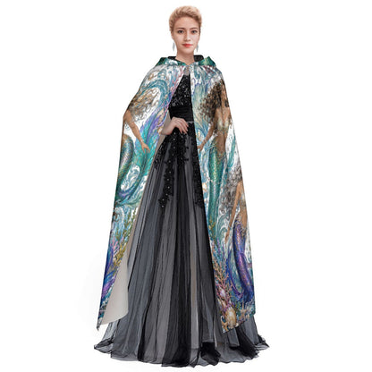 Hooded cloak draped over outfit, showing multicolor ocean mermaid print on white stretch fabric