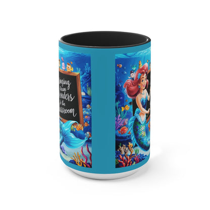 Ocean-themed accent mug with blue sides and black interior, featuring mermaid and coral artwork